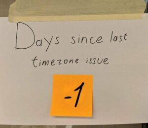 A sign that reads: "Days since last timezone issue -1"