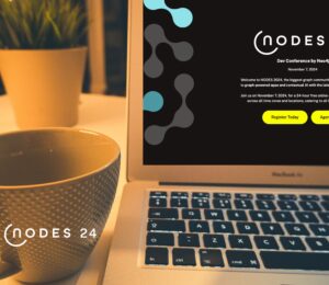 Laptop and coffee cup with NODES 2024 promo